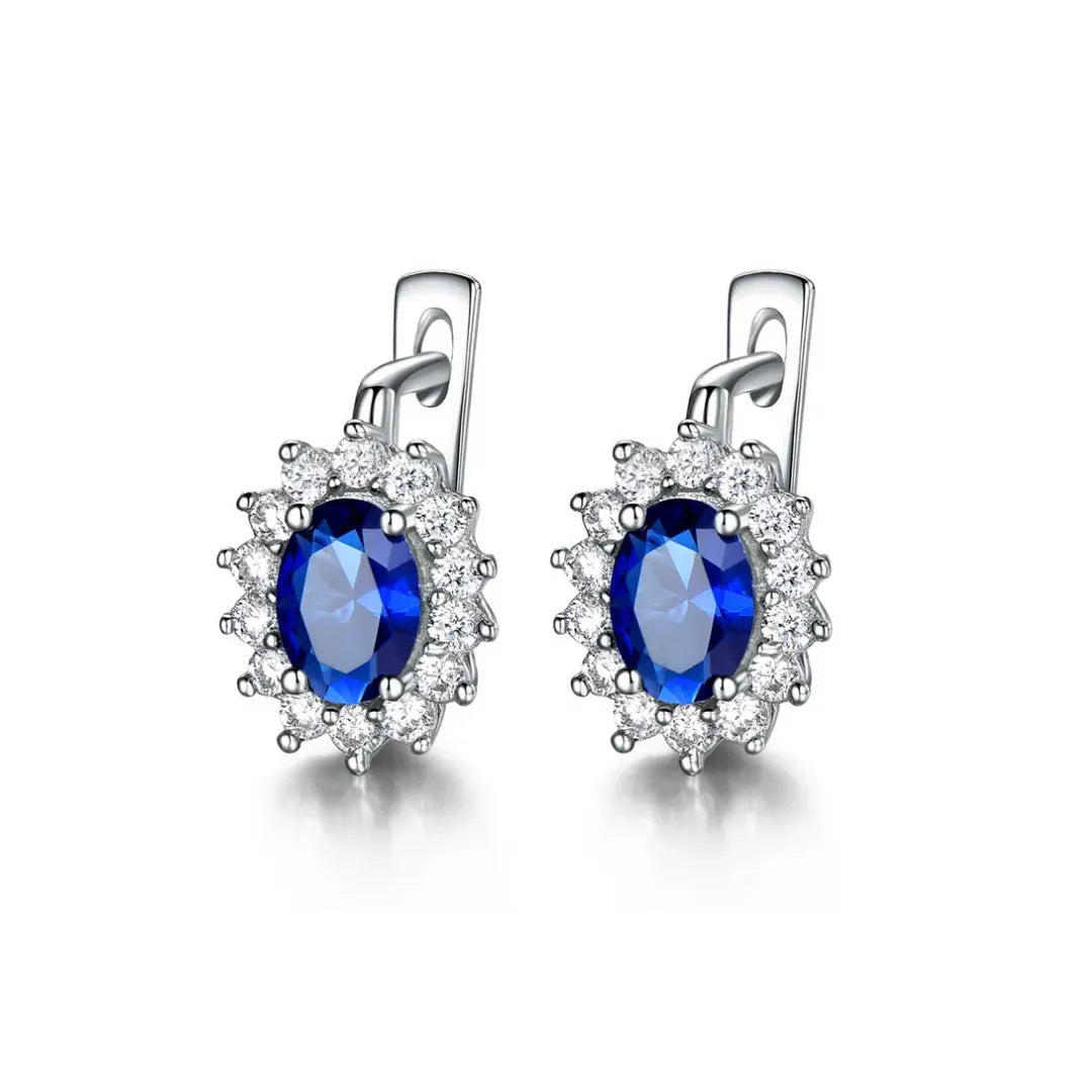 Prata 925 banhada em platina.
Pedra: Zircônia azul e pequenas zircônias brancas. 